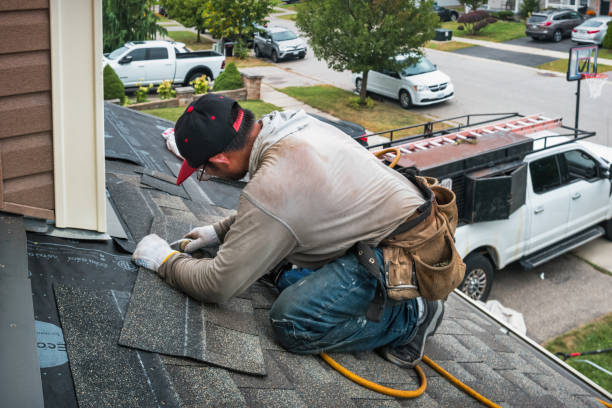 Professional Roofing technician working in Highland, MD